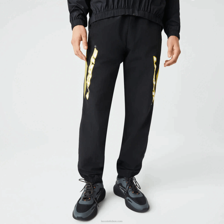homens Lacoste preto amarelo n07 Calça esportiva com blocos de cores de ajuste regular Heritage 08D01110
