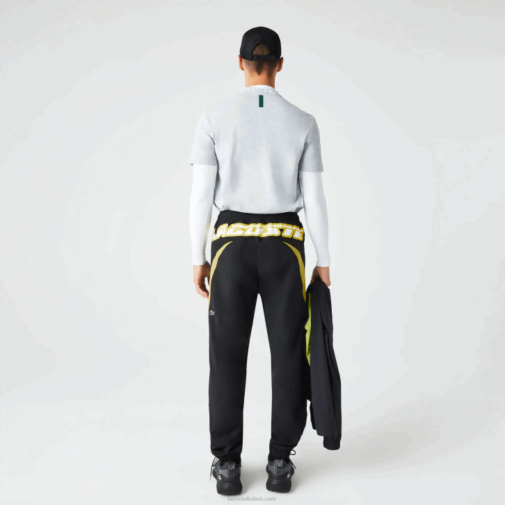 homens Lacoste preto amarelo n07 Calça esportiva com blocos de cores de ajuste regular Heritage 08D01110