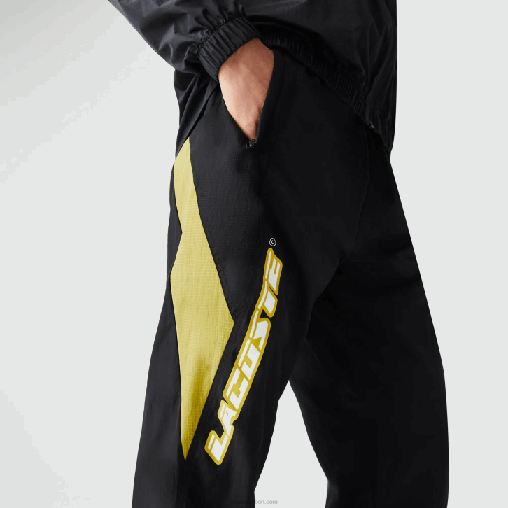 homens Lacoste preto amarelo n07 Calça esportiva com blocos de cores de ajuste regular Heritage 08D01110