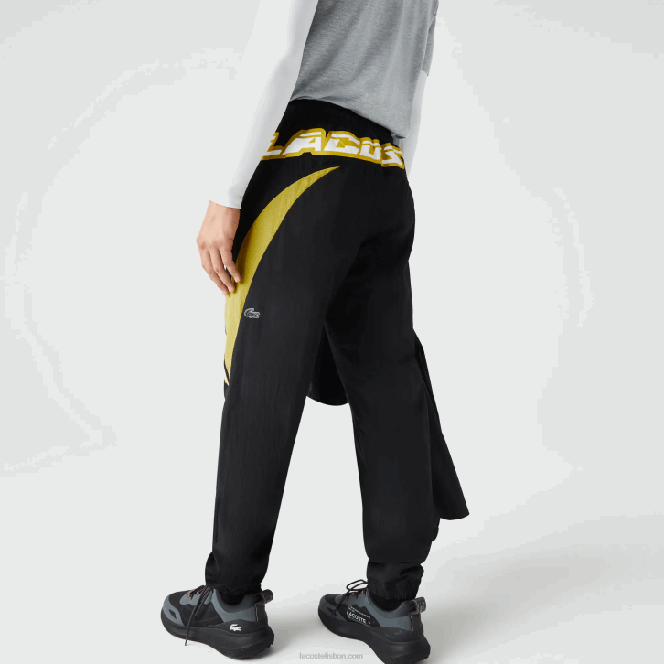 homens Lacoste preto amarelo n07 Calça esportiva com blocos de cores de ajuste regular Heritage 08D01110