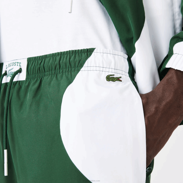 homens Lacoste verde branco 291 calças de trilha gráficas Heritage 08D01072