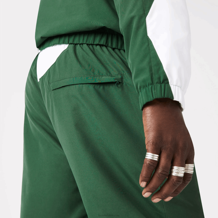 homens Lacoste verde branco 291 calças de trilha gráficas Heritage 08D01072